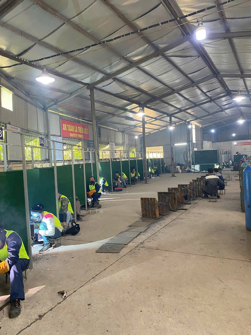 Vietnamese welders at our testing facility.